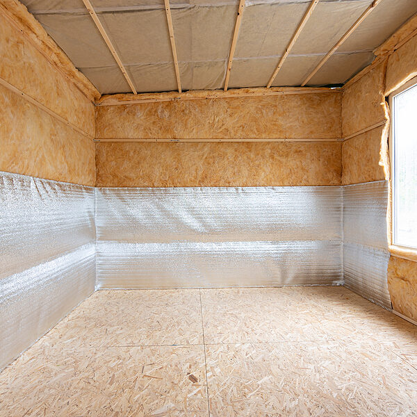 an unfinished room with a window and insulation